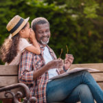 Daughter whispers to dad's ear